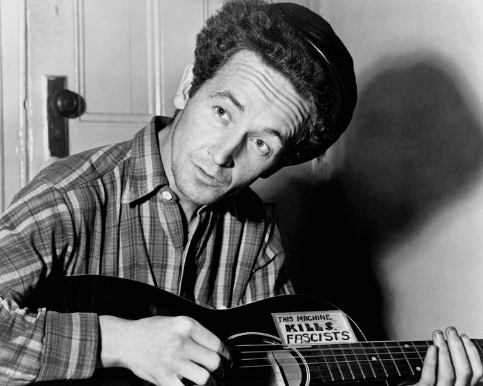 “AI has uncovered forgotten Woody Guthrie treasures—including five songs he wrote about washing dishes!”