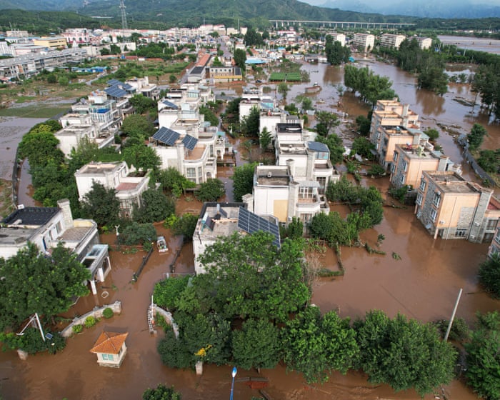 Heavy rains in China have left over 30 dead in Beijing and forced tens of thousands to evacuate.