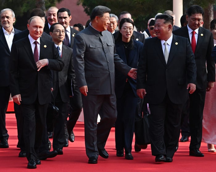 Xi Jinping warns of global choice between peace and conflict as Putin and Kim attend military display.