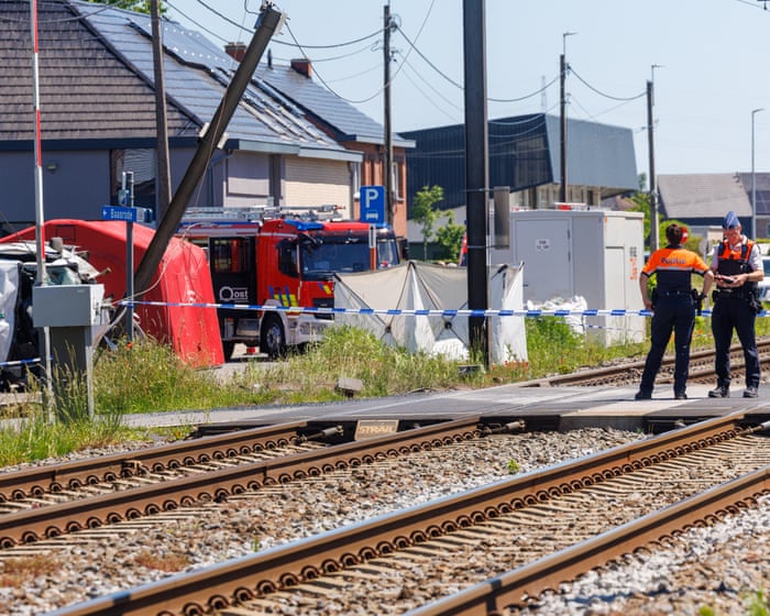 Four people have died in Belgium after a train collided with a school bus.