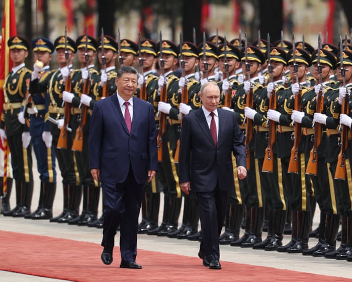 Xi says the world is at risk of falling into a "law of the jungle" as he praises China-Russia ties.