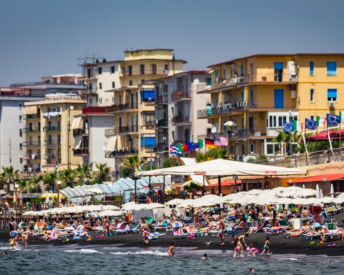 Police carried out a dawn raid targeting people who use umbrellas to reserve beach spots in Naples.