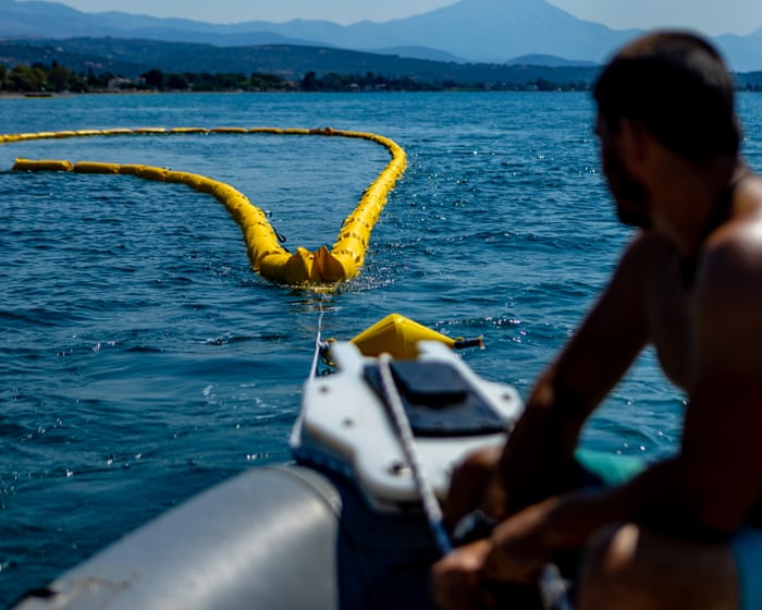 "Better safe than sorry": Greece installs a floating barrier to keep toxic fish away.